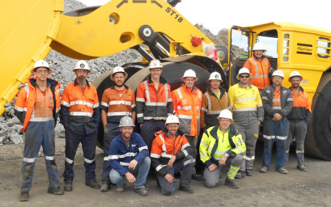 The crew at the Stawell Gold Mine including Atlas Copco technicians and product specialist, proudly pose for a group photo with the new Scooptram ST18.